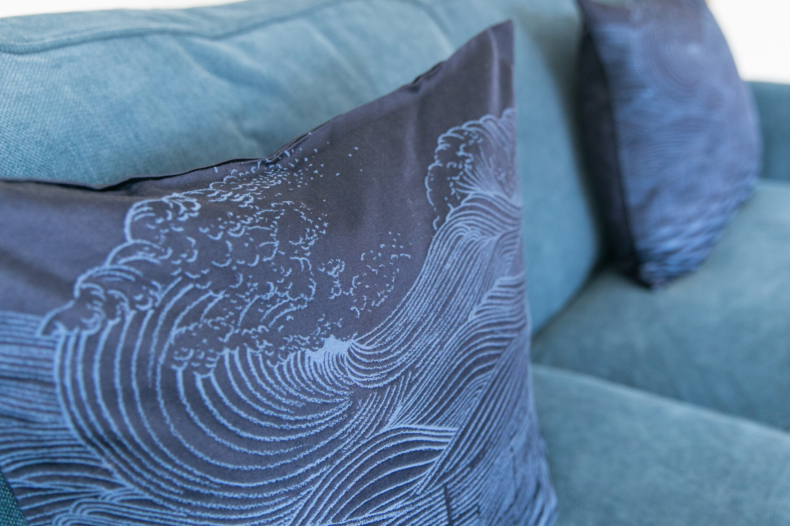 Blue cushion on blue sofa